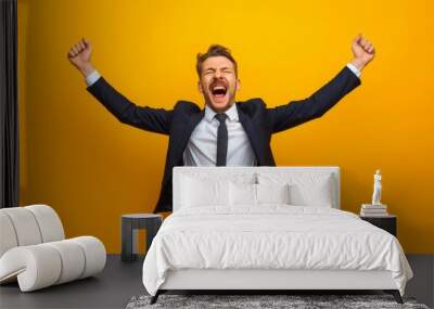 businessman expressing excitement with his mouth agape and arms spread wide, depicting his joy and t Wall mural