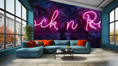 Neon lettering Rock n Roll text, set against a dark metal background. Modern 3D banner template design with neon bright lights Wall mural