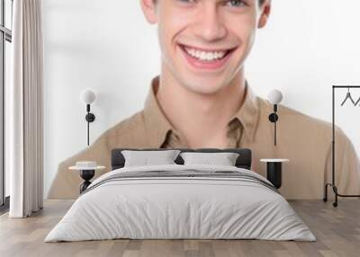 portrait of a smiling young man showing thumbs up against a white background Wall mural