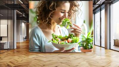 Woman full of joy savoring a fresh salad at home, bathed in natural light, reflecting a vibrant and healthy lifestyle. Wall mural