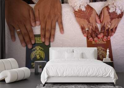 Malang, Indonesia - 28 January 2021: close-up of the Indonesian government's official marriage book and henna decorated hands. Wall mural