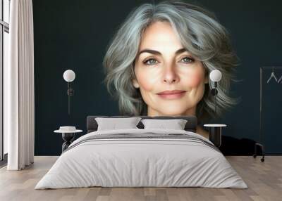 Mature woman with gray hair in studio Wall mural