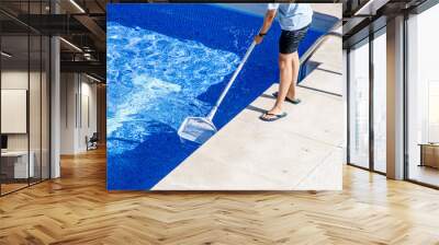 cleaning the swimming pool with a net Wall mural