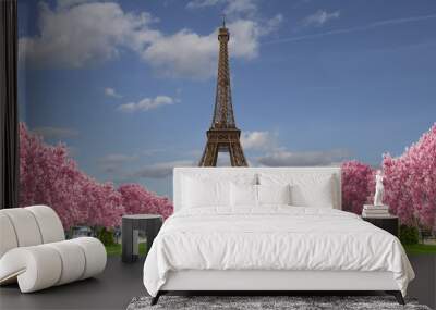 Eiffel tower from Camps of Mars over blue sky with clouds  Wall mural