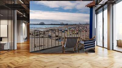 empty chairs on the beach Wall mural