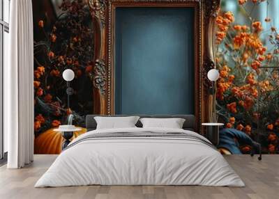 Halloween-themed composition featuring an ornate vintage frame, a carved pumpkin, a witch's hat, and autumn flowers, creating a spooky yet charming atmosphere Wall mural