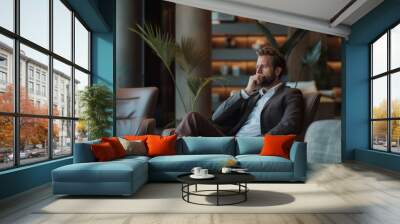 a businessman taking a brief break in a modern office lounge area, sipping coffee while seated in a comfortable chair. The environment is relaxed yet stylish, with soft lighting  Wall mural