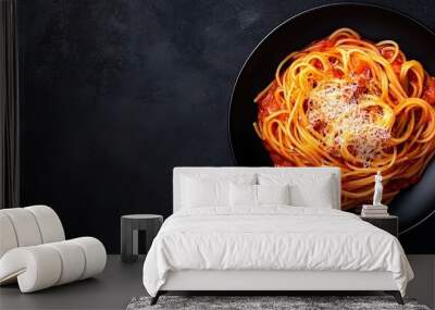 A plate of spaghetti topped with tomato sauce and cheese. Wall mural