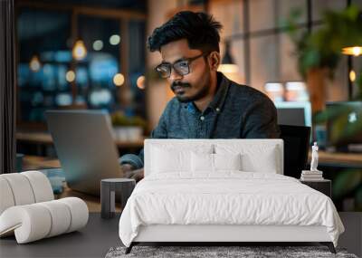 an Indian software engineer working on laptop in modern office, portrait of a man working on laptop  Wall mural