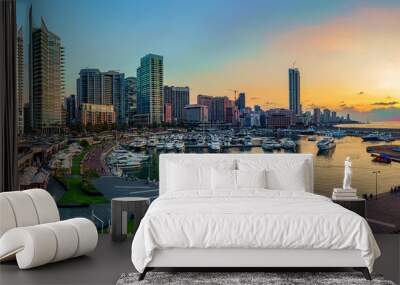 A panoramic photo of Beirut, Lebanon city skyline at sunset, featuring a marina with boats and a scenic waterfront walk.  Wall mural