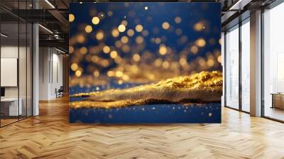 abstract background featuring gold and dark blue particles. Christmas Golden light particles bokeh against a background of navy blue. Texture of gold foil. Wall mural