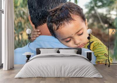 Asian refugee with his sick child at a border Wall mural