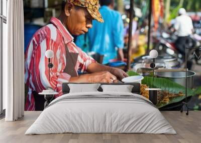 Street Food Vendor Prepares a Meal in Southeast Asia Wall mural