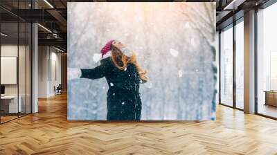 Winter young woman portrait. Beauty Joyful Model Girl laughing and having fun in winter park. Beautiful young woman outdoors. Enjoying nature, wintertime Wall mural