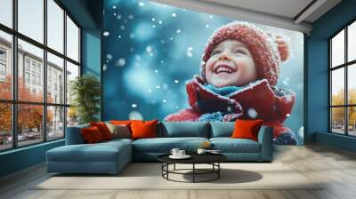 Child laughing outdoors in winter clothes snow background Wall mural