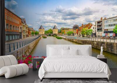 Kortrijk cityscape, promenade of Lys river, Broel Towers buildings and Broel Bridge in Kortrijk city historical centre, red flowers, belgium landmark, West Flanders province, Flemish Region, Belgium Wall mural