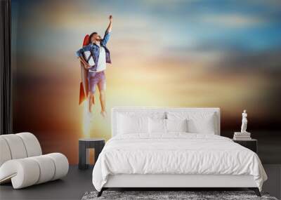 A man flies on a rocket, delivers parcels. Super fast delivery, cool service, online purchase. Copy space, Mixed media Wall mural