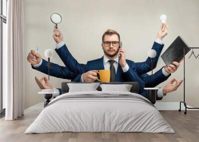 Businessman with many hands in a suit. Works simultaneously with several objects, a mug, a magnifying glass, papers, a contract, a telephone. Multitasking, efficient business worker concept. Wall mural