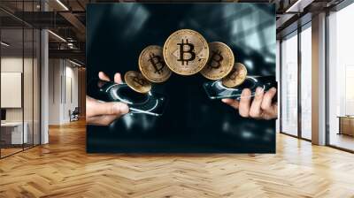 Gold coin Bitcoin payment from phone to phone, hands and TVs close-up. The concept of crypto currency. blockchain technology. Wall mural