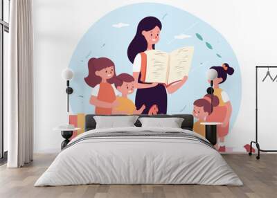 A cartoon vector illustration showing a teacher reading an educational book to a group of young children in a preschool classroom. The concept is focused on teaching children and preschool education Wall mural