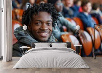 A man with dreadlocks is smiling at the camera Wall mural