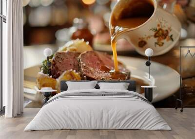 A traditional english roast beef dinner with gravy being poured Wall mural