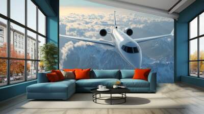 a white airplane flying over a mountain range Wall mural