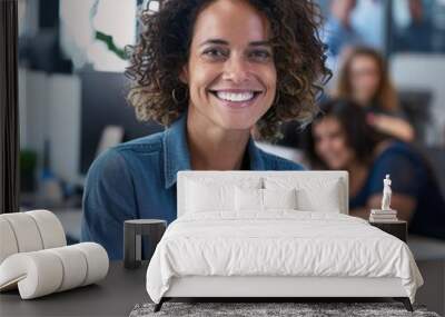 a woman with curly hair smiling in an office Wall mural