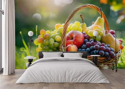 Organic fruit in basket in summer grass. Fresh grapes, pears and apples in nature Wall mural