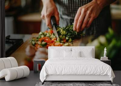 Person chopping vegetables for a homemade healthy meal in the kitchen Wall mural