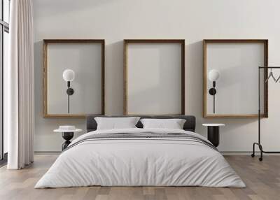 three empty picture frames hanging on a wall Wall mural