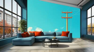 abstract concept banner with copy space featuring an electric power pole against a clear blue sky background Wall mural