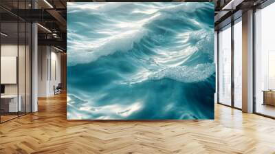 Clear, serene ocean waves in motion, reflecting sunlight, representing tranquility and nature's beauty Wall mural