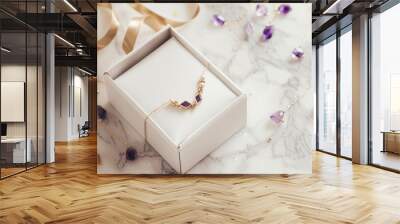 gift box with gold jewelry bracelet adorned with amethyst gemstones on table, free copy space Wall mural