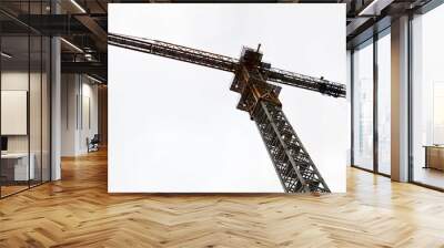 Large powerful construction cargo industrial crane on a construction site of new buildings and houses against the sky Wall mural