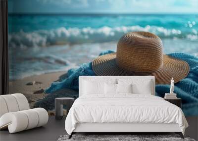 stylish hat on sandy shore with blue beach towel, representing a summer vacation concept banner Wall mural