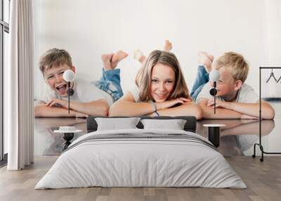 young girl with brothers Wall mural