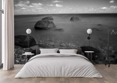 rocks in the sea. black-and-white photos on a large exposure. Wall mural