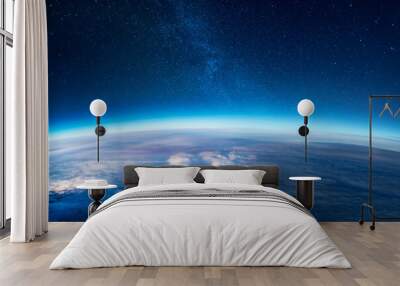 View of stars and milkyway above Earth from space Wall mural