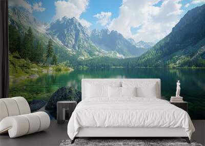   A serene lake nestled amidst towering mountains and lush greenery, with verdant forests extending along its shores Wall mural