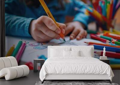 A child is drawing a picture on a piece of paper Wall mural