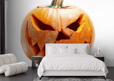 A pumpkin with a scary face carved into it Wall mural