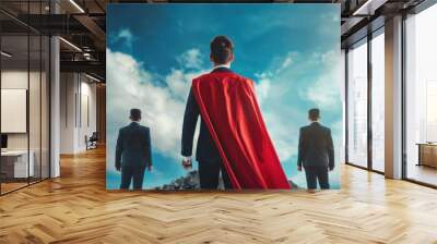 Three men in suits stand on a mountain, one of them wearing a red cape. Concept of power and confidence, as the man in the red cape stands tall and looks out over the landscape Wall mural