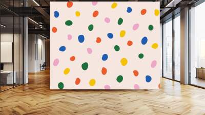 Colorful polka dot abstract pattern on beige background. Contemporary childish doodle design. Vector circle confetti backdrop. Fun simple festive banner template Wall mural