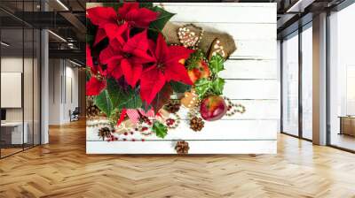 Christmas table decoration with christmas flower, red poinsettia, top view Wall mural