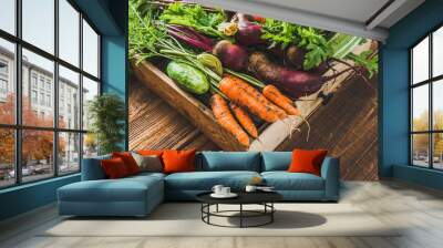 Fresh vegetable, organic produce on farmer market. Vegetables in the box on wooden table. Wall mural