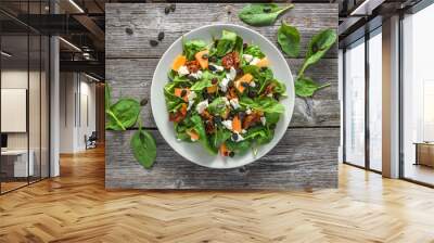 Fruits and vegetable salad, fresh food on plate on wooden background, healthy nutrition concept Wall mural