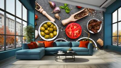 Mediterranean food background. Cooking ingredients on dark stone. Wall mural