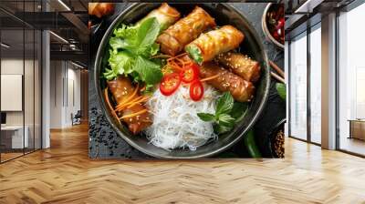 Top view of Asian food: Cold rice vermicelli with sauce, paired with fried spring rolls in a bowl  Wall mural