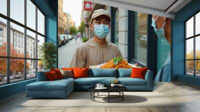 Asian delivery man wearing face mask holding meal delivering to client, man customer taking delivery paper eco bag with grocery takeout food meal from man courier holding paper package delivery,  Wall mural